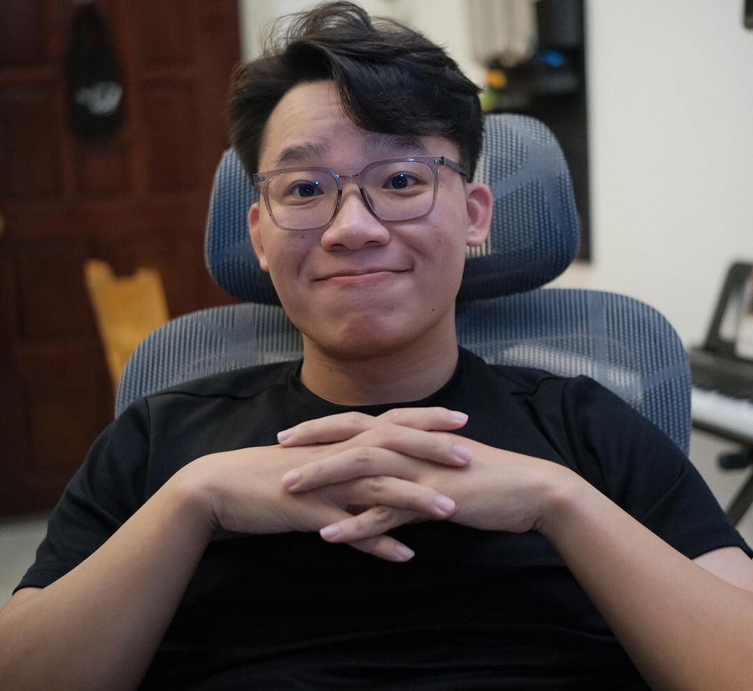 Portrait of a young man with glasses smiling