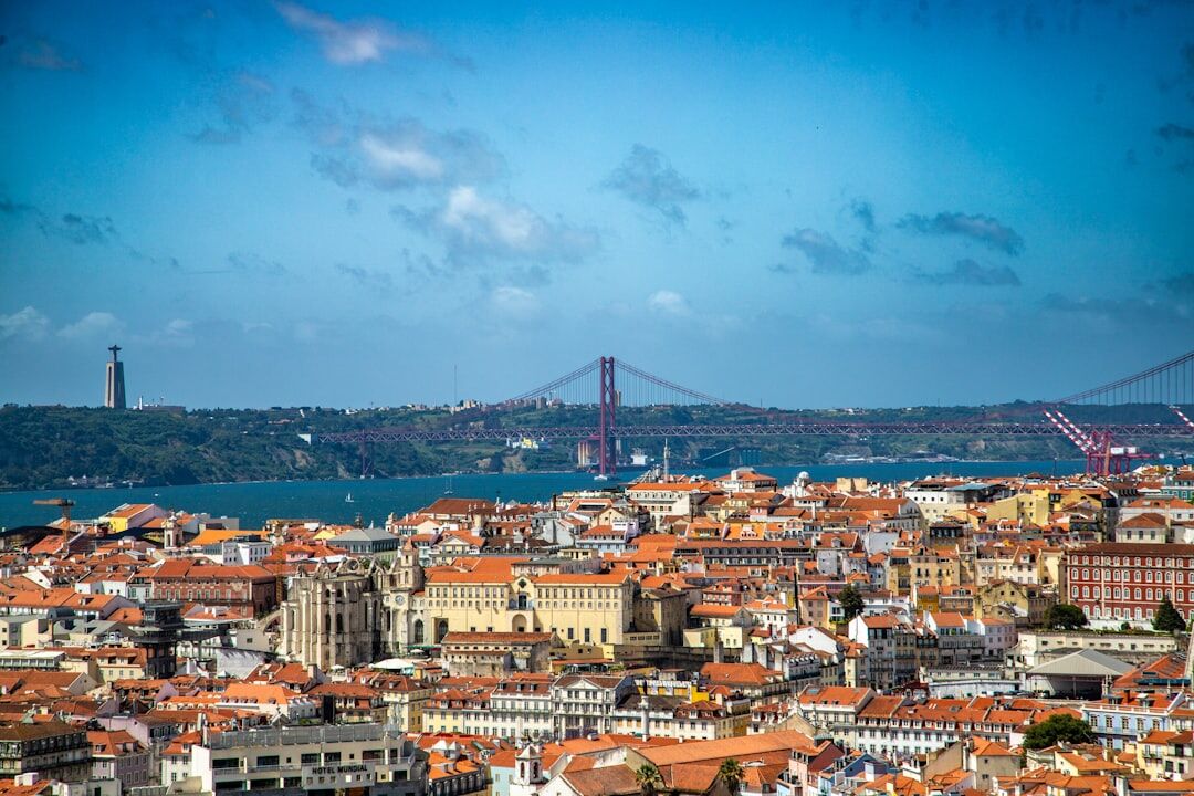 Lisbon city skyline at dusk with warm lights