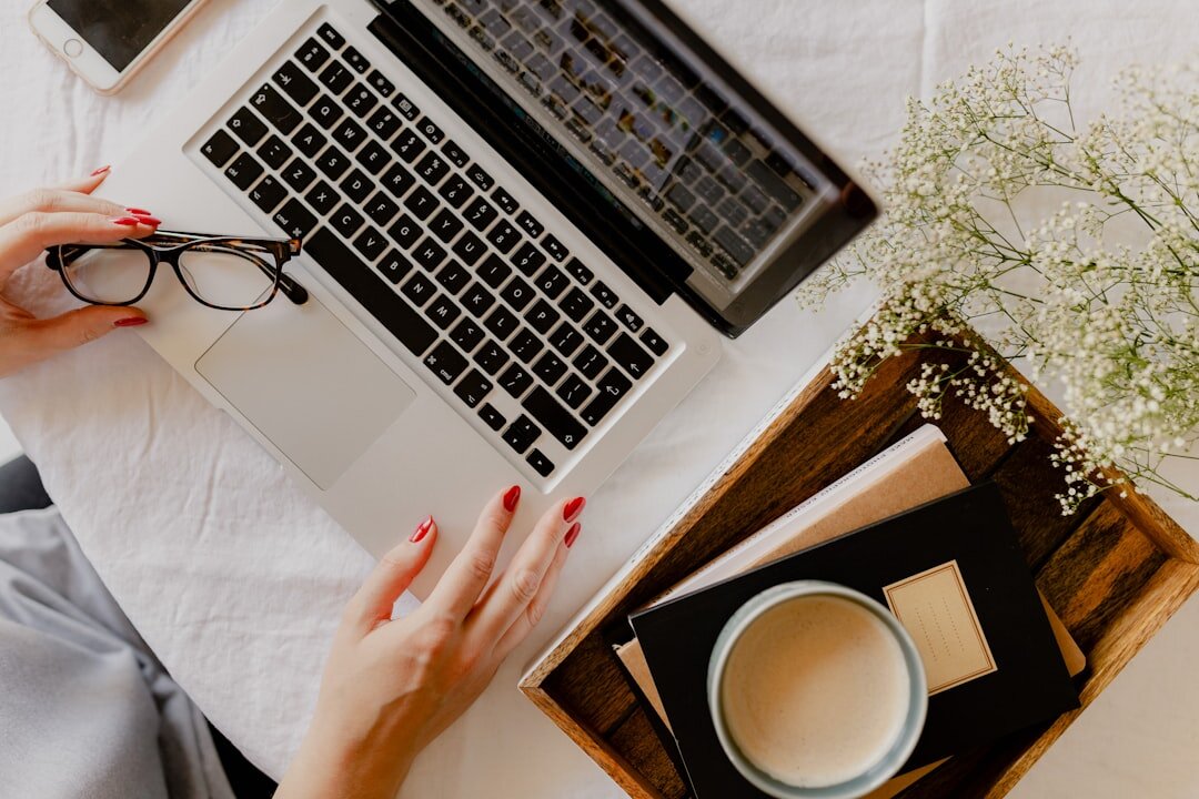blogger at desk with laptop