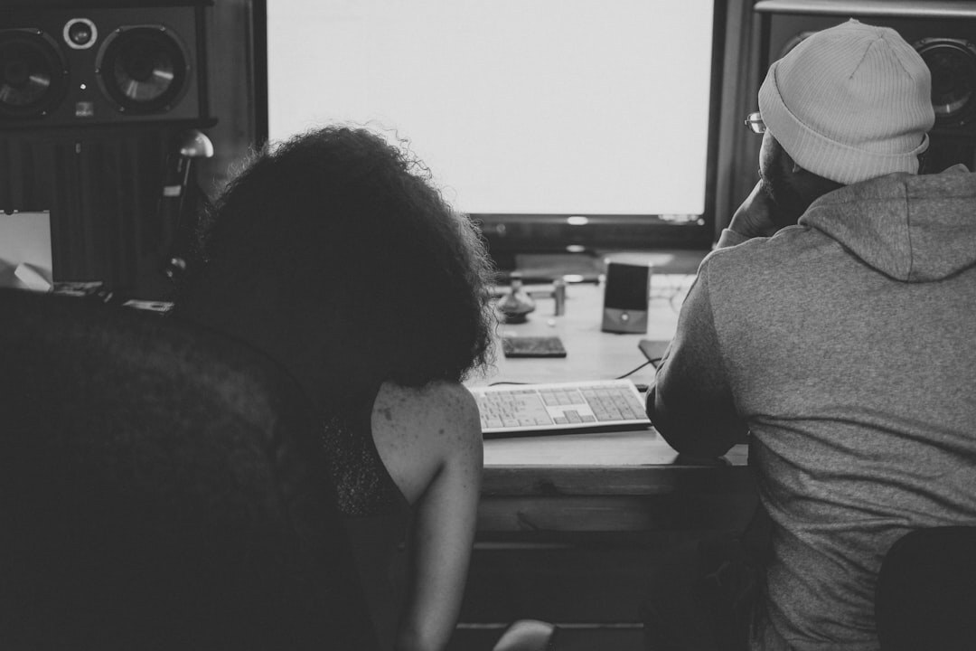 woman editing audio on computer